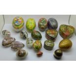 A collection of papier mache trinket boxes, egg shape boxes and carved shells