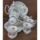 A Royal Albert Lavender Rose six setting tea set, lacking one saucer