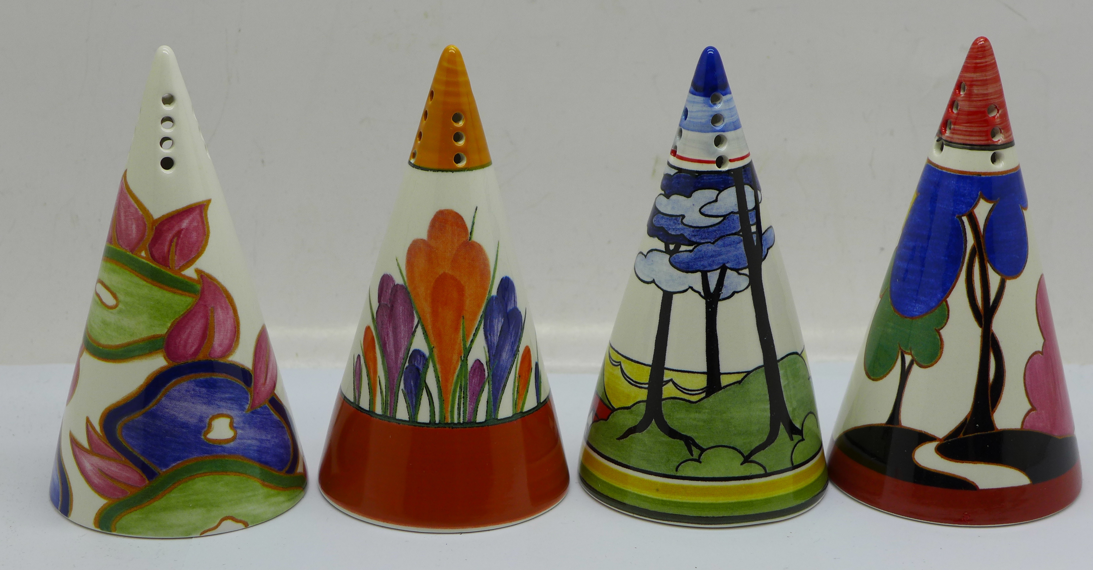 Four Wedgwood Clarice Cliff shakers, Blue Chintz, Autumn, Blue Firs and Crocus, boxed and with