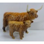 A Beswick Highland Cow and Calf