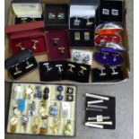 Thirty-two pairs of cufflinks and eight tie pins