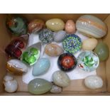 A collection of paperweights and stone 'eggs'