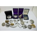 A collection of brooches and other jewellery including St. Justin pewter