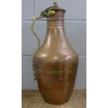 A large copper and brass water jug with lid, 54cm