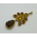 A 9ct gold pendant set with smoky quartz, citrine and garnets, 6.7g, 42mm without loop