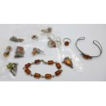 A collection of silver and amber set jewellery