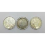 An 1887 USA one dollar coin, New Orleans mint, a 2002 USA 1oz. fine silver one dollar coin and a
