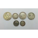 Five Victorian silver coins, with 'bun head', including an 1865 shilling with 116 die number, and