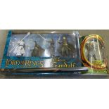 The Lord of the Rings;- Legolas action figure, Return of Gandalf boxed game and poster (all