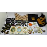 A collection of badges and uniform patches