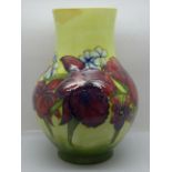 A Moorcroft orchid vase, chip to rim, 25.5cm