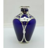 A blue glass vase with silver overlay, marked sterling, 84mm