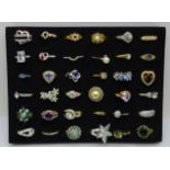 A collection of thirty-six dress rings