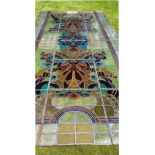 A very large Victorian stained glass window, consisting of eighteen separate leaded panels, total