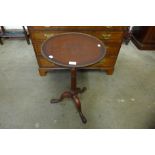 A mahogany tripod wine table