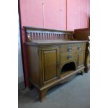 An Arts and Crafts Maple & Co. Ltd. oak sideboard