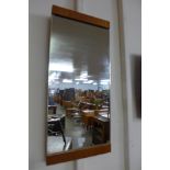 A teak framed mirror