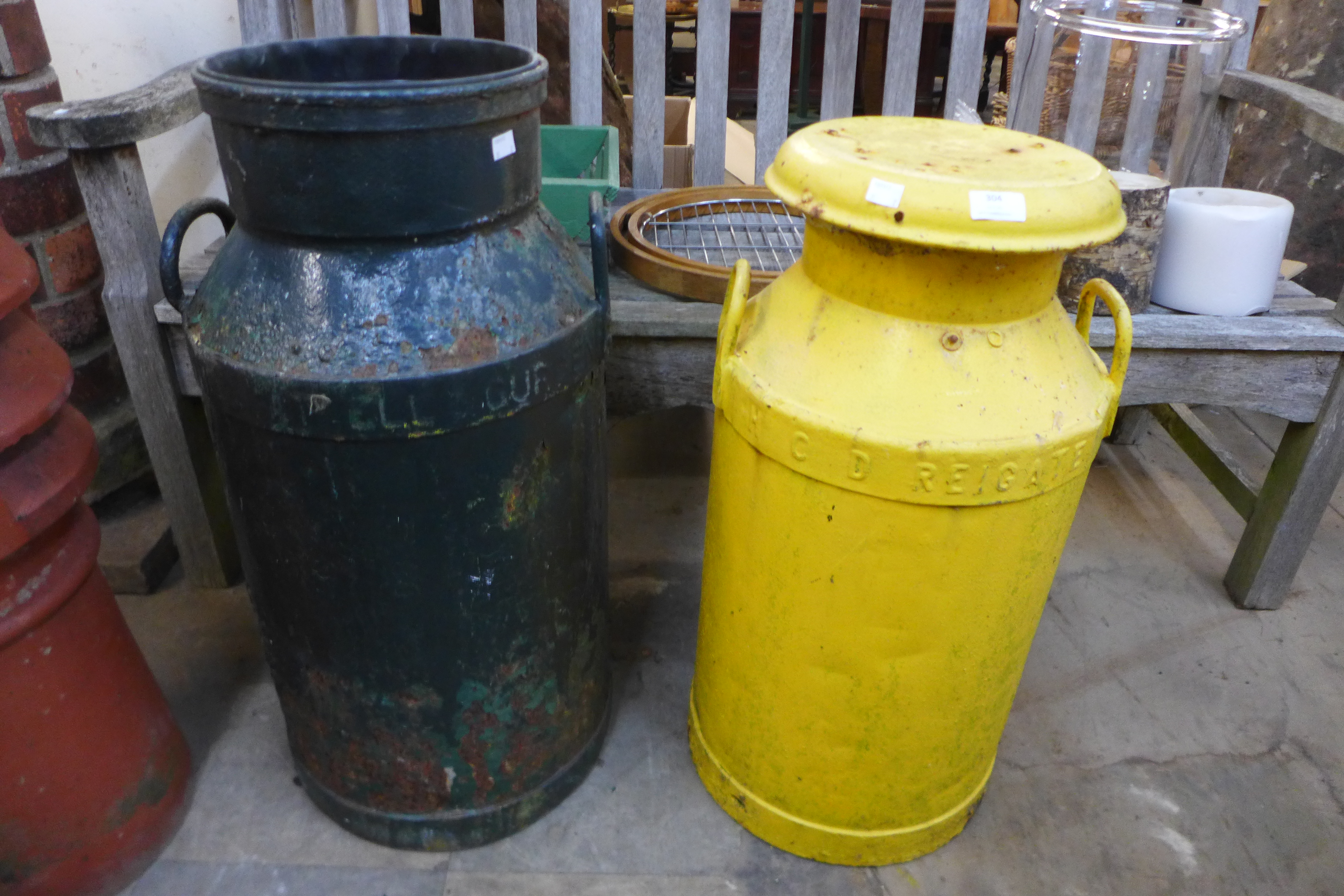 Two painted milk churns