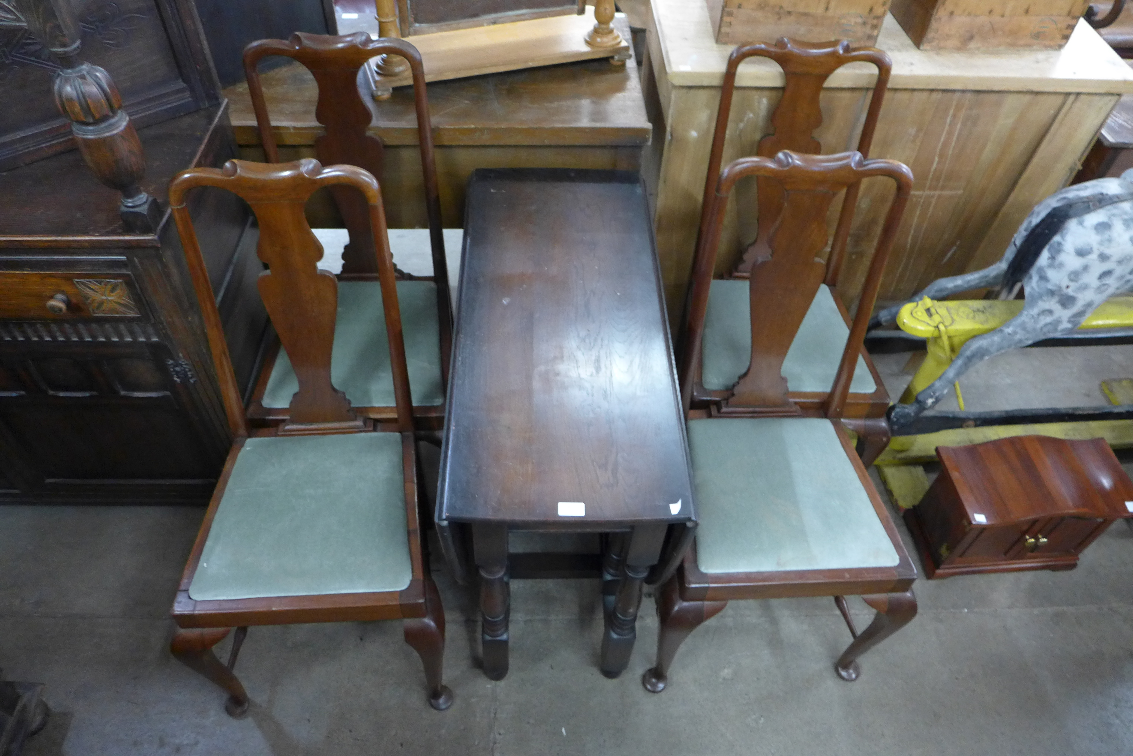 An oak gateleg table and four Queen Anne style mahogany chairs