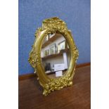 A Victorian style ormolu strut mirror