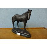 A bronze figure of a horse, on black marble socle, 23cms h