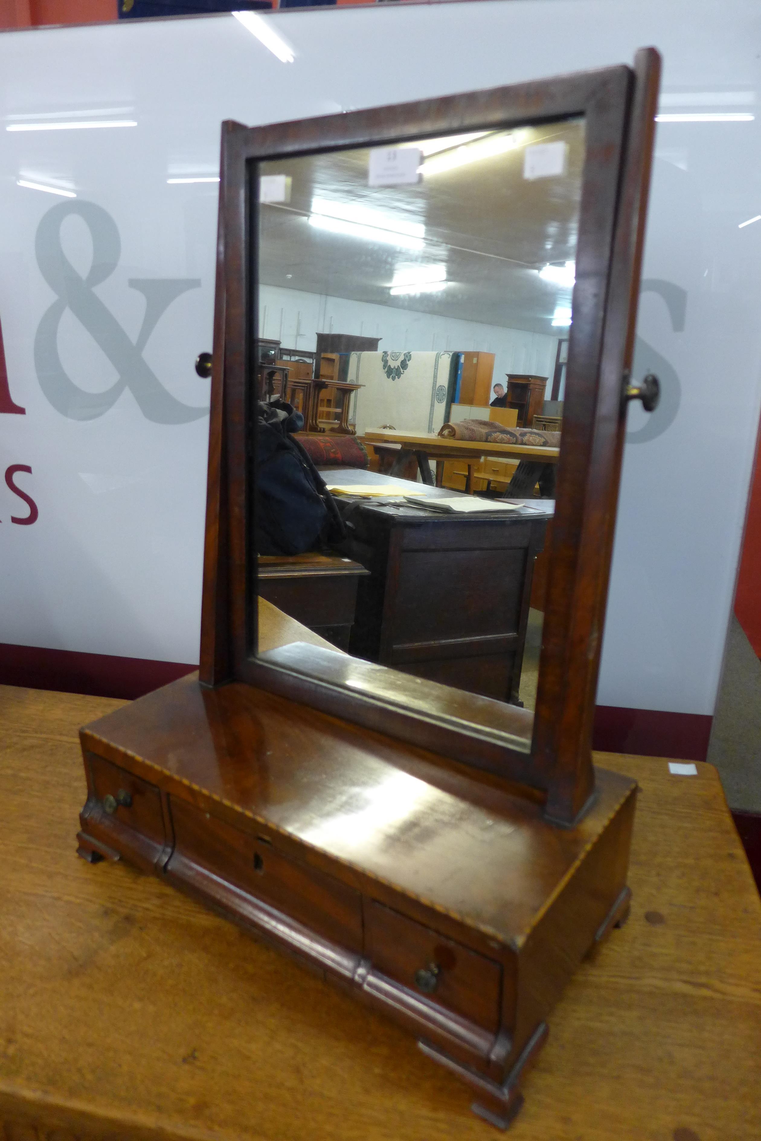 A George III inlaid mahogany toilet mirror