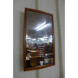 A teak framed mirror