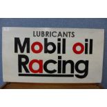 A painted Mobil Oil Racing sign