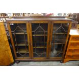 An early 20th Century oak three door bookcase