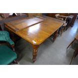 A Victorian oak extending dining table