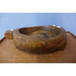 A rustic carved wooden fruit bowl