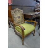 An Art Deco walnut bergere fireside chair