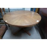 An Art Deco style oak circular coffee table