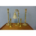 A brass table lamp, a pair of painted candlesticks and a pair of brass candlesticks
