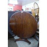 A Victorian mahogany circular tilt-top breakfast table