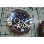 A Rolex style dealers wall clock