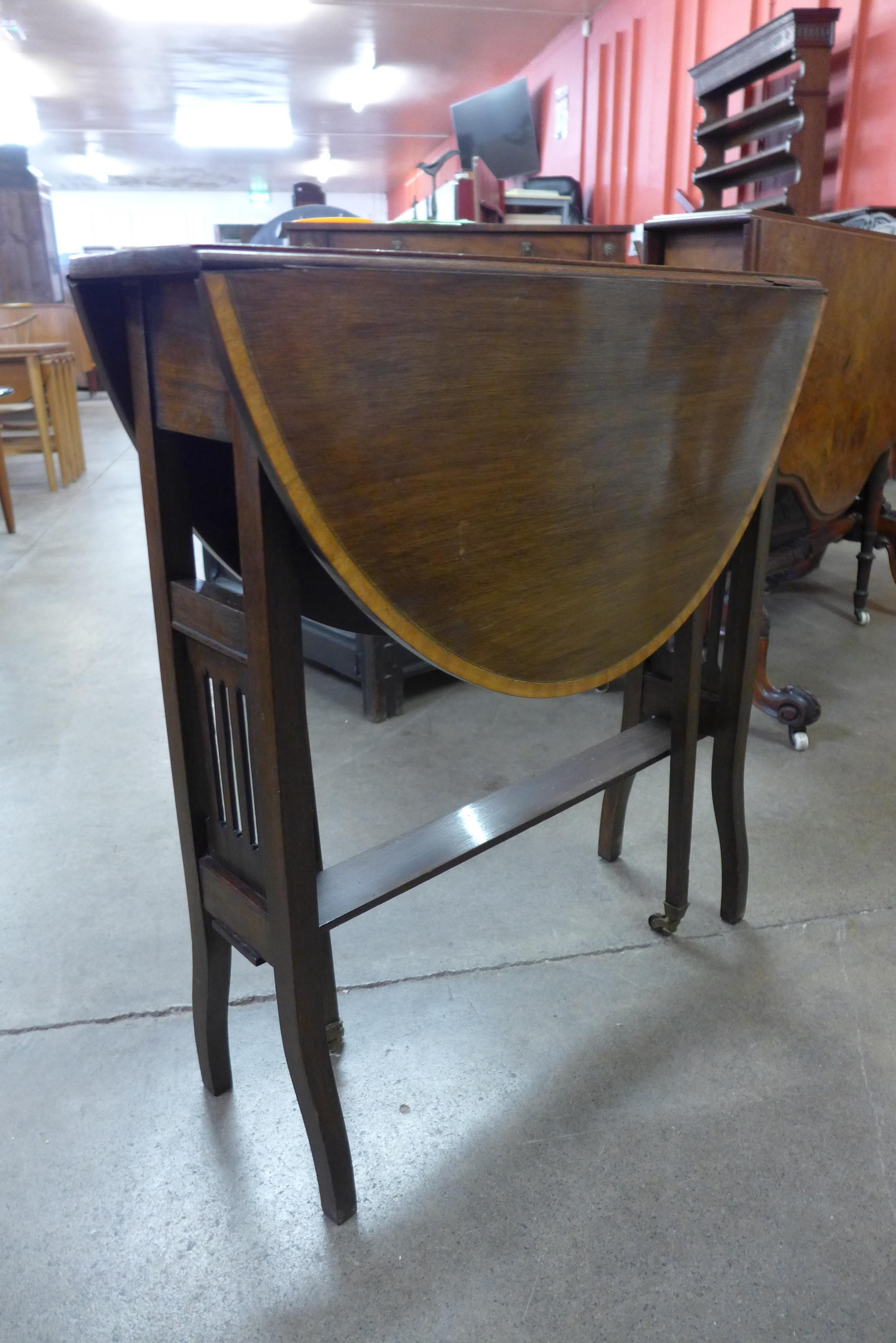 An Edward VII inlaid mahogany Sutherland table