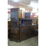 An oak freestanding corner cupboard and a carved oak court cupboard