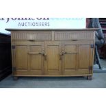 A Nigel Griffiths oak Cotswold style sideboard