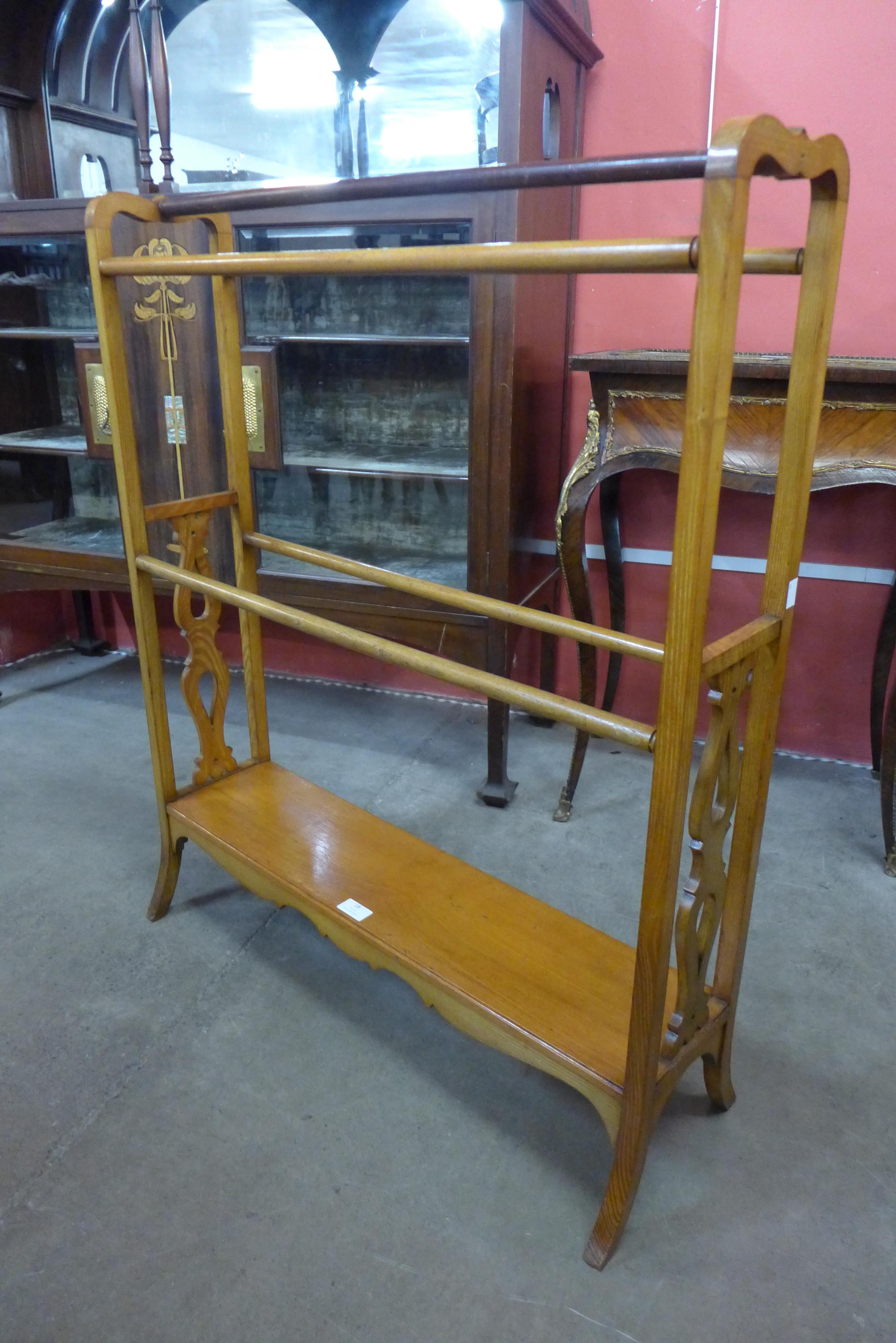 A Victorian oak towel rail