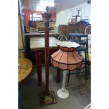 A red and gilt metal standard lamp and a table lamp