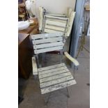 A set of four galvanized steel and painted pine folding garden armchairs