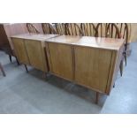 A pair of Danish Kai Kristiansen teak tambour front cabinets and a chest of drawers