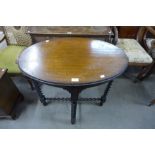 An oak barleytwist oval centre table