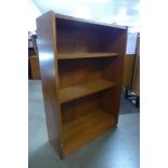 A small teak open bookcase