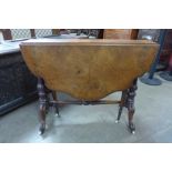 A Victorian figured walnut butterfly Sutherland table