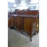 A Chippendale Revival mahogany serpentine sideboard