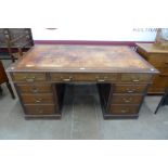 A George III style mahogany pedestal library desk
