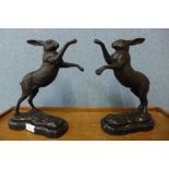 A pair of French style bronze figures of boxing hares, 30cms h