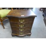 A small burr walnut serpentine chest of drawers